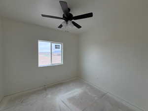 Spare room with a ceiling fan