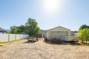 View of yard with a detached garage