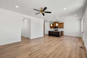 Unfurnished living room featuring recessed lighting, light wood finished floors, and a ceiling fan