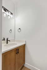 Bathroom with vanity and light wood-style flooring