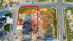 Aerial view of property and surrounding area featuring property parcel outlined