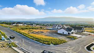 View of mountain background featuring nearby suburban area