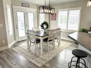 Dining room with baseboards and light wood-style floors