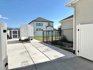 View of patio / terrace featuring a shed. Dog run is 12'x19'6"
