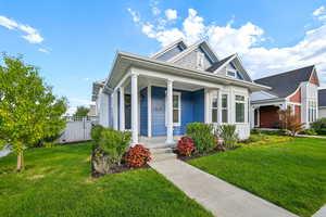 Bungalow-style home featuring covered porch