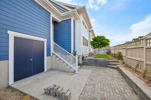 Property entrance featuring a patio area