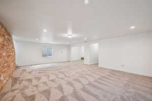 Unfurnished room featuring light carpet and recessed lighting