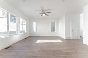Unfurnished room featuring light wood-type flooring, ceiling fan, and recessed lighting