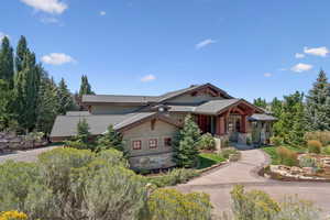 View of front of house featuring stone siding