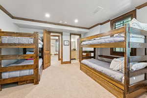 Bedroom featuring ornamental molding, multiple windows, light carpet, and recessed lighting