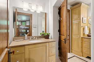 Bathroom featuring vanity and ensuite bath