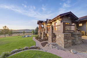 View of patio with a deck with mountain view