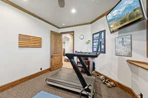Workout room featuring ornamental molding, recessed lighting, arched walkways, and ceiling fan