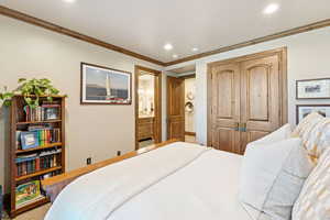 Bedroom featuring crown molding, a closet, recessed lighting, and ensuite bath