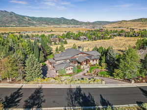 Aerial view of property's location with a mountain backdrop