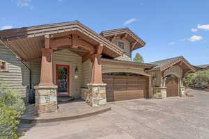 View of front facade featuring a garage and concrete driveway