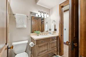 Bathroom featuring vanity and toilet