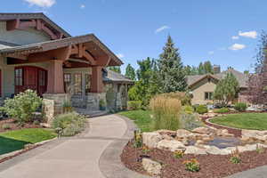Surrounding community featuring a yard and covered porch