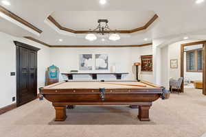 Playroom featuring a raised ceiling, carpet floors, recessed lighting, billiards table, and ornamental molding