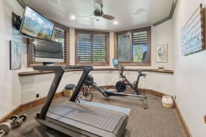 Workout room featuring a ceiling fan, carpet, and recessed lighting