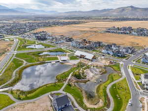 View of property location with nearby suburban area and a water and mountain view