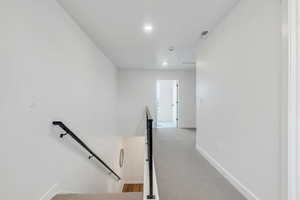 Stairway featuring carpet floors and recessed lighting