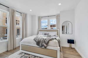 Bedroom featuring light wood finished floors and recessed lighting
