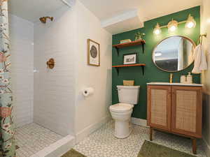 Full bathroom with a stall shower and vanity