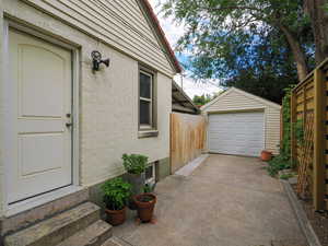 Detached garage with concrete driveway