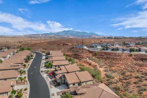 Aerial perspective of suburban area with a mountainous background