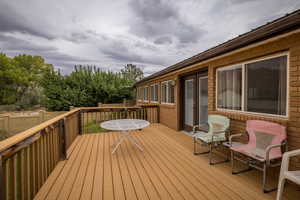 Deck with view of wooded area