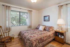 Bedroom with wood finished floors