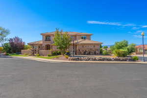 Mediterranean / spanish home featuring stucco siding, a balcony, and a tiled roof