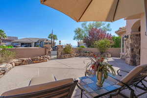 View of patio featuring a gate