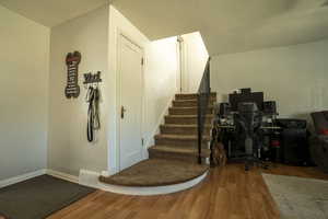 Office space with wood finished floors and baseboards