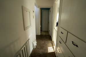 Hall with dark colored carpet