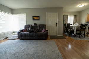 Living room with light wood-style flooring