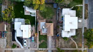 Aerial view of property and surrounding area with nearby suburban area and property boundaries highlighted