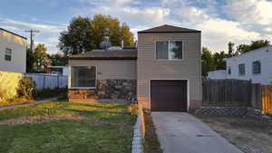 View of front of house featuring a garage and driveway