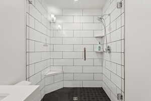 Full bath with a stall shower and vanity