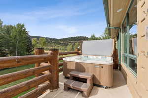 View of patio / terrace featuring a hot tub