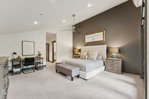 Bedroom with lofted ceiling, a desk, light colored carpet, recessed lighting, and ceiling fan