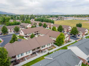 Aerial perspective of suburban area with a mountain backdrop