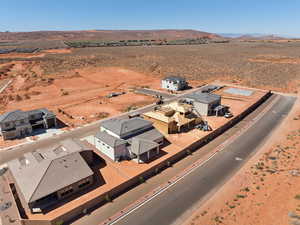 Aerial perspective of suburban area featuring a desert landscape and mountains