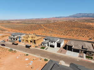 Aerial view of residential area with a mountainous background and a desert landscape