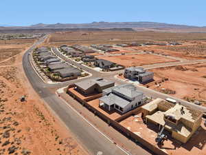 Overview of rural landscape featuring a mountain backdrop and nearby suburban area