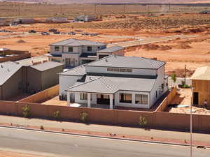 Aerial view of sparsely populated area featuring a desert landscape and mountains
