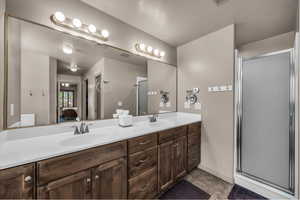 Ensuite bathroom with double vanity and a shower stall