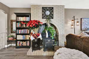 Living area with wood finished floors and baseboards