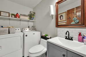 Main floor half bath and laundry. Washer and dryer are included